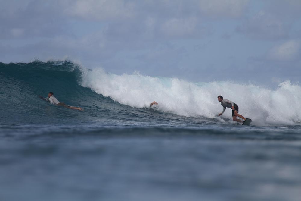 A surfer riding, with the app's detection box around them